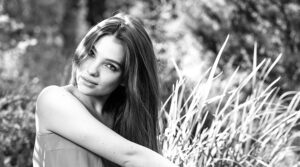 Beautiful woman sitting out doors