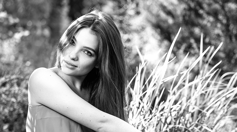 Beautiful woman sitting out doors